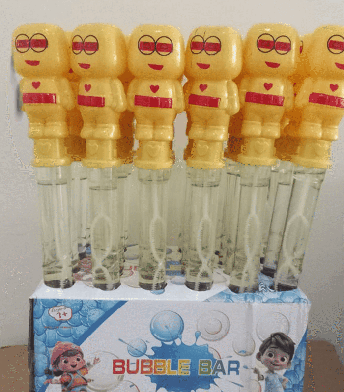 Bubble wand toy with a smiling face